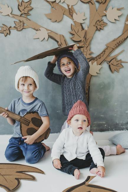 Children Sitting on Floor Playing with Cardboards